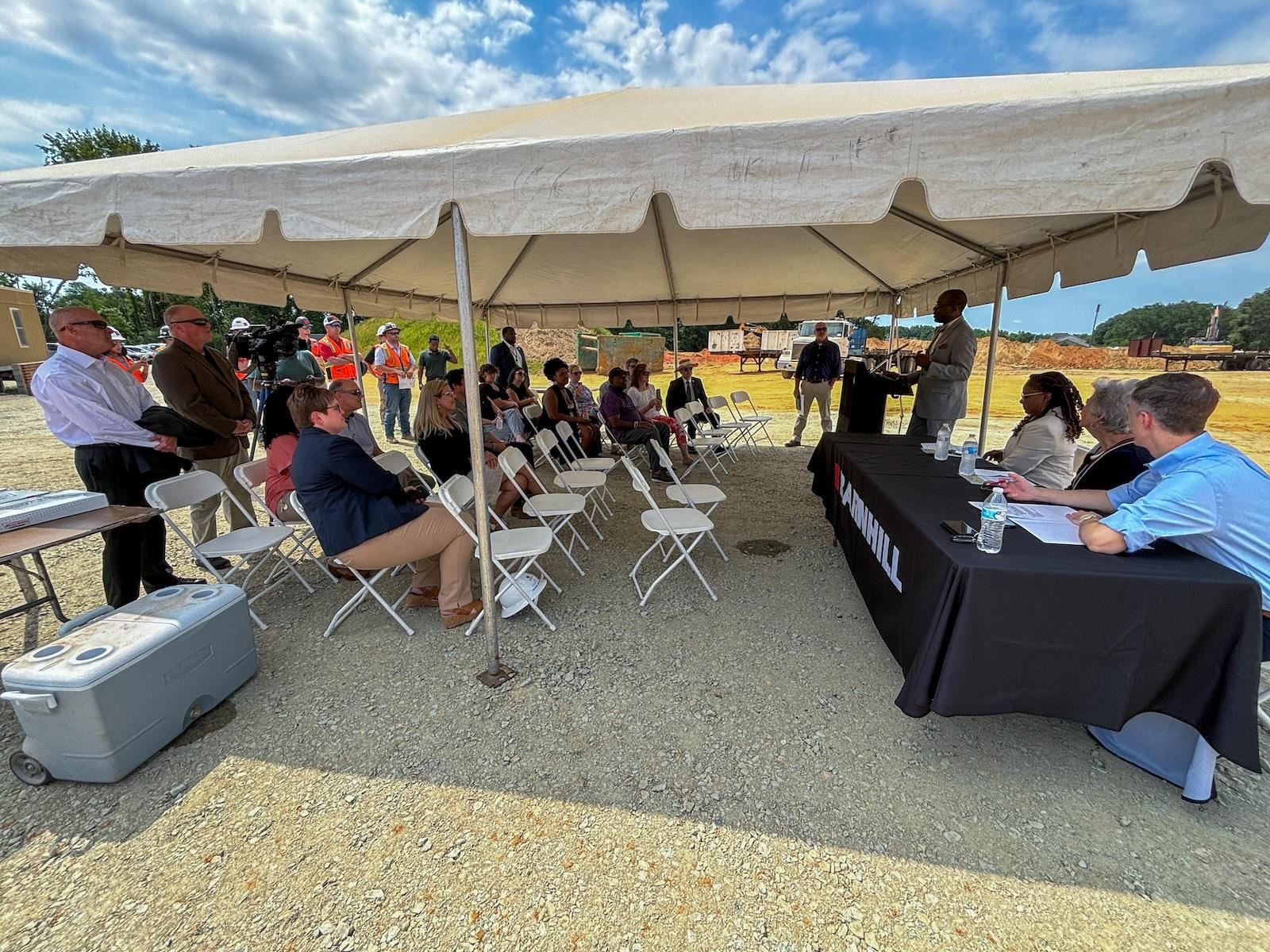 Guests eagerly await the turning of the dirt